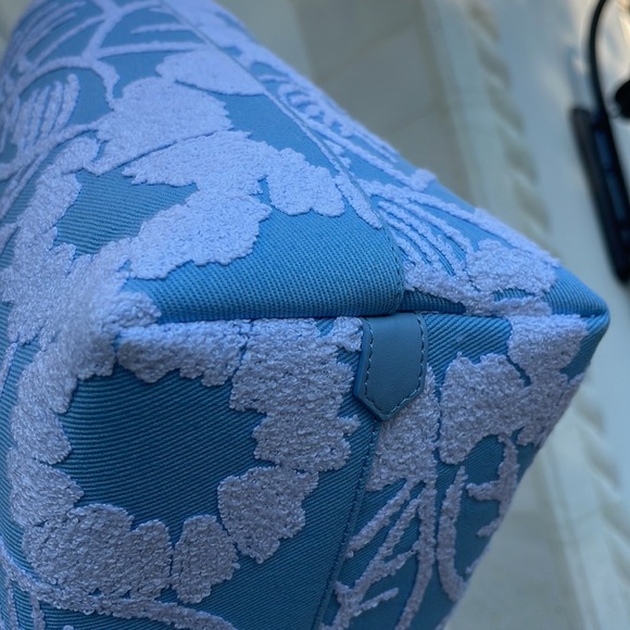 This Prada embroidered drill tote features an enlarged Prada logo on the front. - Picture 4 of 11